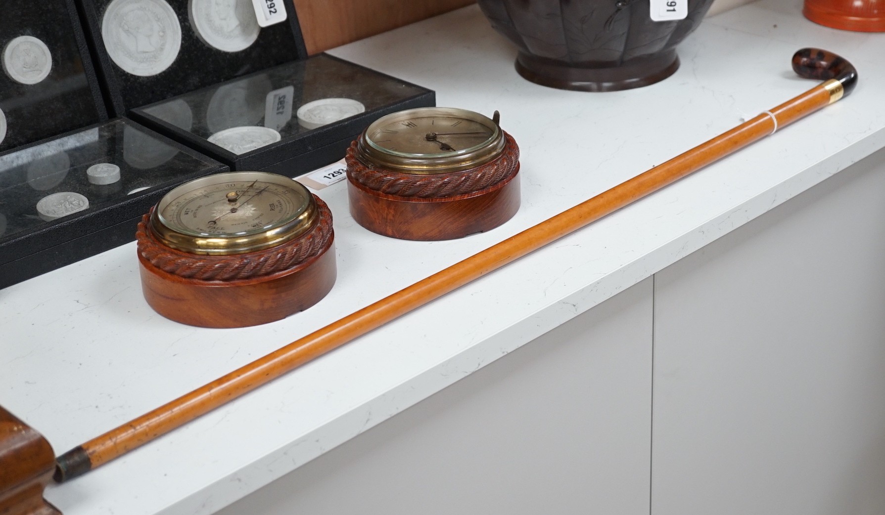 An 18ct gold collared malacca cane, with a horn handled handle, stained as tortoiseshell, 94 cms long